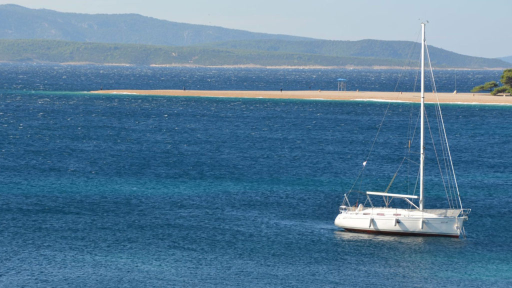 A sailboat off the coast of Zlatni Rat in Croatia.