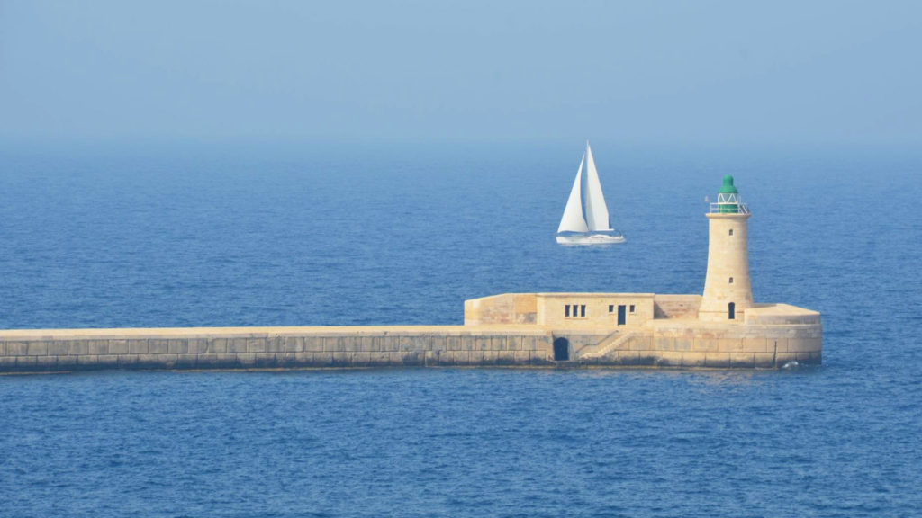 A sailboat near St. Elmo Fortress in Malta.